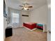 Bright bedroom with carpeted floor, ceiling fan, and window coverings at 10439 Waterstone Dr, Riverview, FL 33578