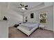 Spacious main bedroom with large bed, carpeted floor, and ceiling fan at 10439 Waterstone Dr, Riverview, FL 33578