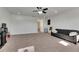 Bonus room with a couch, TV, and plenty of natural light at 10439 Waterstone Dr, Riverview, FL 33578