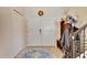 Bright entryway with double doors, coat rack, and tile flooring at 10439 Waterstone Dr, Riverview, FL 33578