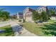 Landscaped yard with two-story house and large driveway at 10439 Waterstone Dr, Riverview, FL 33578