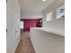 Well-lit hallway with carpet and access to bedrooms at 10439 Waterstone Dr, Riverview, FL 33578
