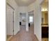 Hallway with carpet and doors to bedrooms and bath at 10439 Waterstone Dr, Riverview, FL 33578