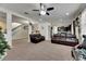 Open living room with high ceilings, leather couches, and view of staircase at 10439 Waterstone Dr, Riverview, FL 33578