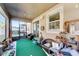 Relaxing screened porch with artificial turf and seating area at 10439 Waterstone Dr, Riverview, FL 33578