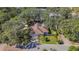 Aerial view of the house and surrounding landscape at 1116 N Riverhills Dr, Temple Terrace, FL 33617