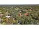 Aerial view showcasing the home's location within a residential area at 1116 N Riverhills Dr, Temple Terrace, FL 33617
