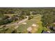 Aerial view showing the location of the property near a golf course at 1116 N Riverhills Dr, Temple Terrace, FL 33617
