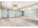 Primary bedroom with mirrored walls and a chandelier at 1116 N Riverhills Dr, Temple Terrace, FL 33617