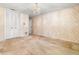 Bedroom with double closets and patterned wallpaper at 1116 N Riverhills Dr, Temple Terrace, FL 33617