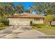 Attached garage with ample parking space at 1116 N Riverhills Dr, Temple Terrace, FL 33617