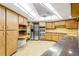 Large kitchen with ample counter space and stainless steel appliances at 1116 N Riverhills Dr, Temple Terrace, FL 33617