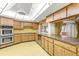Spacious kitchen with ample cabinetry, granite countertops, and double oven at 1116 N Riverhills Dr, Temple Terrace, FL 33617