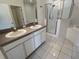 Bathroom with double sinks, shower, and garden tub at 1140 Andrew Aviles Cir, Tampa, FL 33619