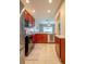 Modern kitchen with stainless steel appliances and wood cabinets at 12303 Foxmoor Peak Dr, Riverview, FL 33579