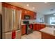 Modern kitchen with stainless steel appliances and wood cabinets at 12303 Foxmoor Peak Dr, Riverview, FL 33579