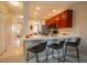 Kitchen island with seating for three and a white quartz countertop at 12303 Foxmoor Peak Dr, Riverview, FL 33579