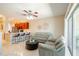 Living room with light green couches, a coffee table, and access to a patio at 12303 Foxmoor Peak Dr, Riverview, FL 33579