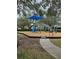 Community playground with play structures under a shaded canopy at 12303 Foxmoor Peak Dr, Riverview, FL 33579