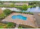 Community pool with surrounding lounge chairs and landscaping at 12303 Foxmoor Peak Dr, Riverview, FL 33579
