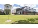Large backyard featuring a screened lanai, outdoor seating, and a pool for the ultimate outdoor retreat at 14324 Moon Flower Dr, Tampa, FL 33626