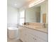 Bathroom featuring double sinks and a modern stand alone tub, creating a spa-like oasis at 14324 Moon Flower Dr, Tampa, FL 33626