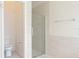 Contemporary bathroom featuring a toilet and a glass-enclosed shower, designed with clean lines at 14324 Moon Flower Dr, Tampa, FL 33626