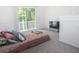 Bright bedroom with a sliding glass door to a balcony at 14324 Moon Flower Dr, Tampa, FL 33626
