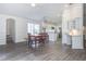 Bright open-concept space with dining table, kitchen, and living room, filled with natural light at 14324 Moon Flower Dr, Tampa, FL 33626