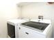 Laundry room with modern washer and dryer at 14324 Moon Flower Dr, Tampa, FL 33626