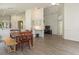 Open concept living room featuring hardwood floors, dining area and bright neutral paint at 14324 Moon Flower Dr, Tampa, FL 33626