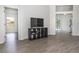Spacious living room with wood floors and views into additional rooms of the house at 14324 Moon Flower Dr, Tampa, FL 33626