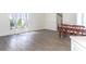 Inviting living area with hardwood flooring and natural light streaming through sheer-curtained windows at 14324 Moon Flower Dr, Tampa, FL 33626