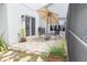 Cozy patio space with neutral flagstone and outdoor seating, ideal for relaxation at 14324 Moon Flower Dr, Tampa, FL 33626