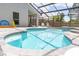 Inviting pool and spa combo with a screened enclosure, plus a sun shelf for relaxing afternoons at 14324 Moon Flower Dr, Tampa, FL 33626