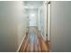 Bright hallway with light wood flooring leading to rooms at 14368 Ermine Owl Rd, Weeki Wachee, FL 34614