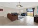 Living room with sliding doors leading to backyard at 16675 Carlton Pond St, Wimauma, FL 33598