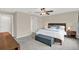 Main bedroom with king-size bed and private access to bathroom at 16675 Carlton Pond St, Wimauma, FL 33598