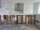 Unfinished kitchen awaiting renovation, showing exposed framing and plumbing at 1710 Shore Acres Ne Blvd, St Petersburg, FL 33703