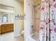 Bathroom with shower/tub combo and beach-themed decor at 17853 Green Willow Dr, Tampa, FL 33647