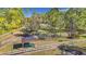 Community dog park with benches, shade structure, and fenced area at 17853 Green Willow Dr, Tampa, FL 33647