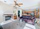 Living area with fireplace, leather sofa and kitchen access at 17853 Green Willow Dr, Tampa, FL 33647