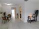 Bright dining area with tile floors and access to kitchen at 2460 Enterprise Rd # 3, Clearwater, FL 33763