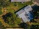 Aerial view of a home with a well-maintained roof, and a spacious backyard at 2640 Westchester N Dr, Clearwater, FL 33761