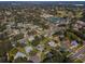 Aerial view of the neighborhood showcasing its homes, lush greenery, and community amenities at 2640 Westchester N Dr, Clearwater, FL 33761