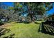 Spacious backyard with a large shade tree at 2640 Westchester N Dr, Clearwater, FL 33761