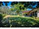 Expansive backyard featuring a pergola and play set, perfect for outdoor enjoyment at 2640 Westchester N Dr, Clearwater, FL 33761