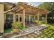 Charming outdoor patio with a wood pergola offering a cozy backyard retreat at 2640 Westchester N Dr, Clearwater, FL 33761