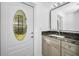 Bathroom features a granite countertop and a decorative glass window in the door at 2640 Westchester N Dr, Clearwater, FL 33761