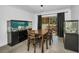 Dining room with table and chairs, flanked by aquariums at 2640 Westchester N Dr, Clearwater, FL 33761